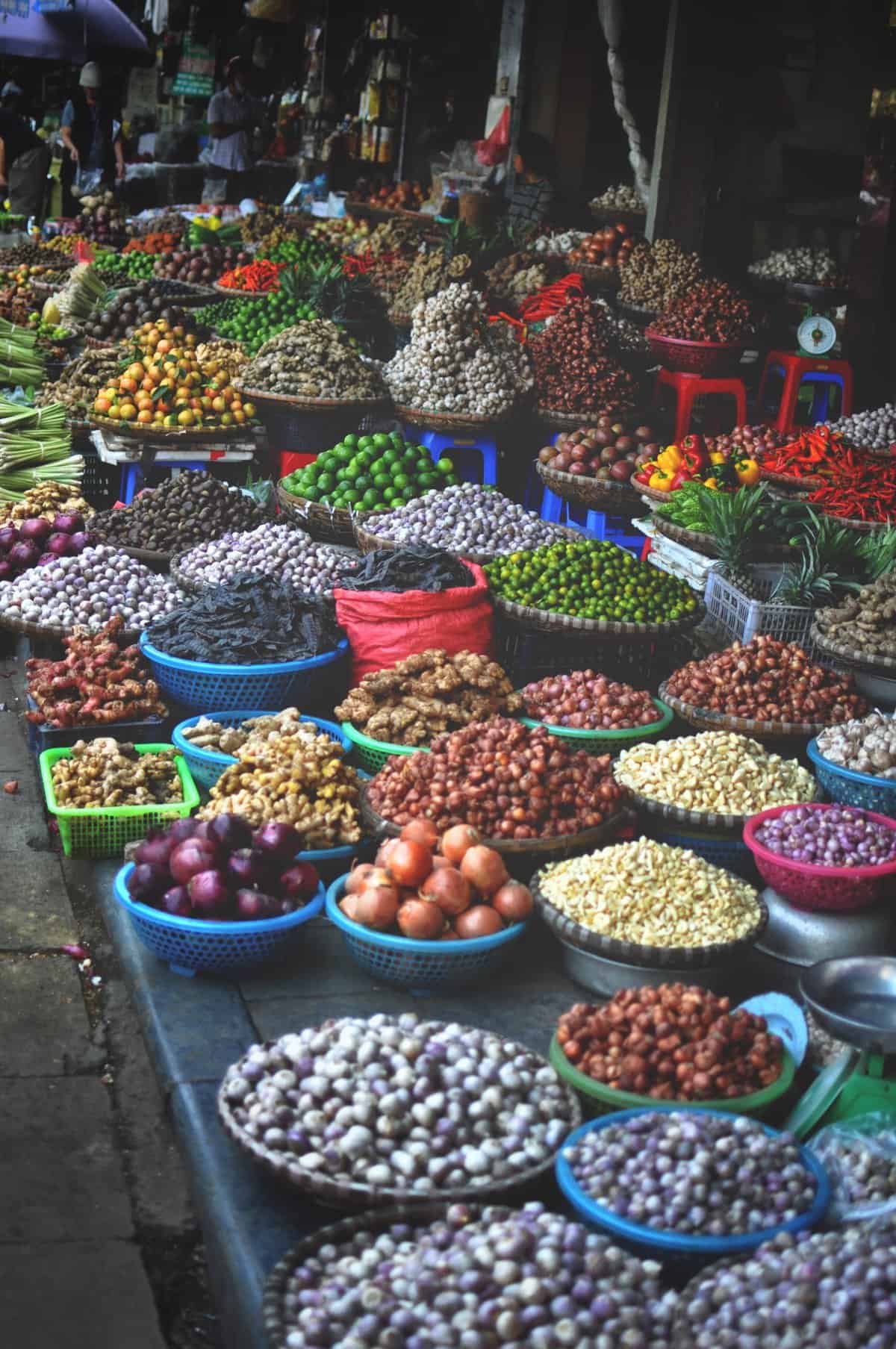A fresh market on the streets of Hanoi, Vietnam featuring fruit, vegetables and endless food