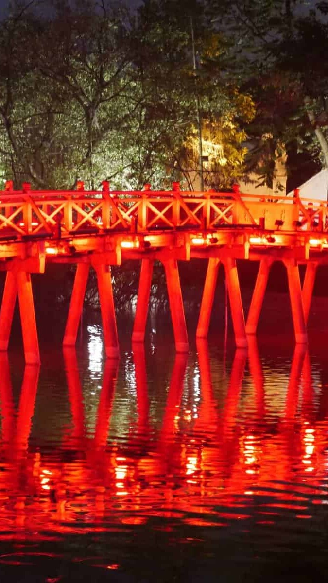 A night photo of the Rising Sun Bridge in Hanoi, Vietnam