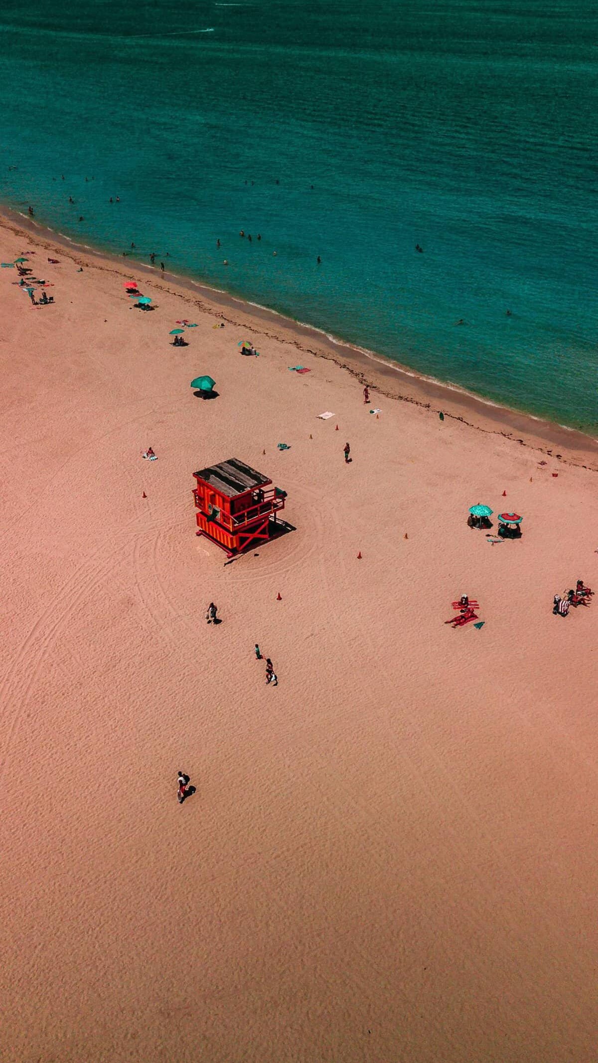 Drone shot of South Beach in Miami with the Iconic Pink Life Guard shack