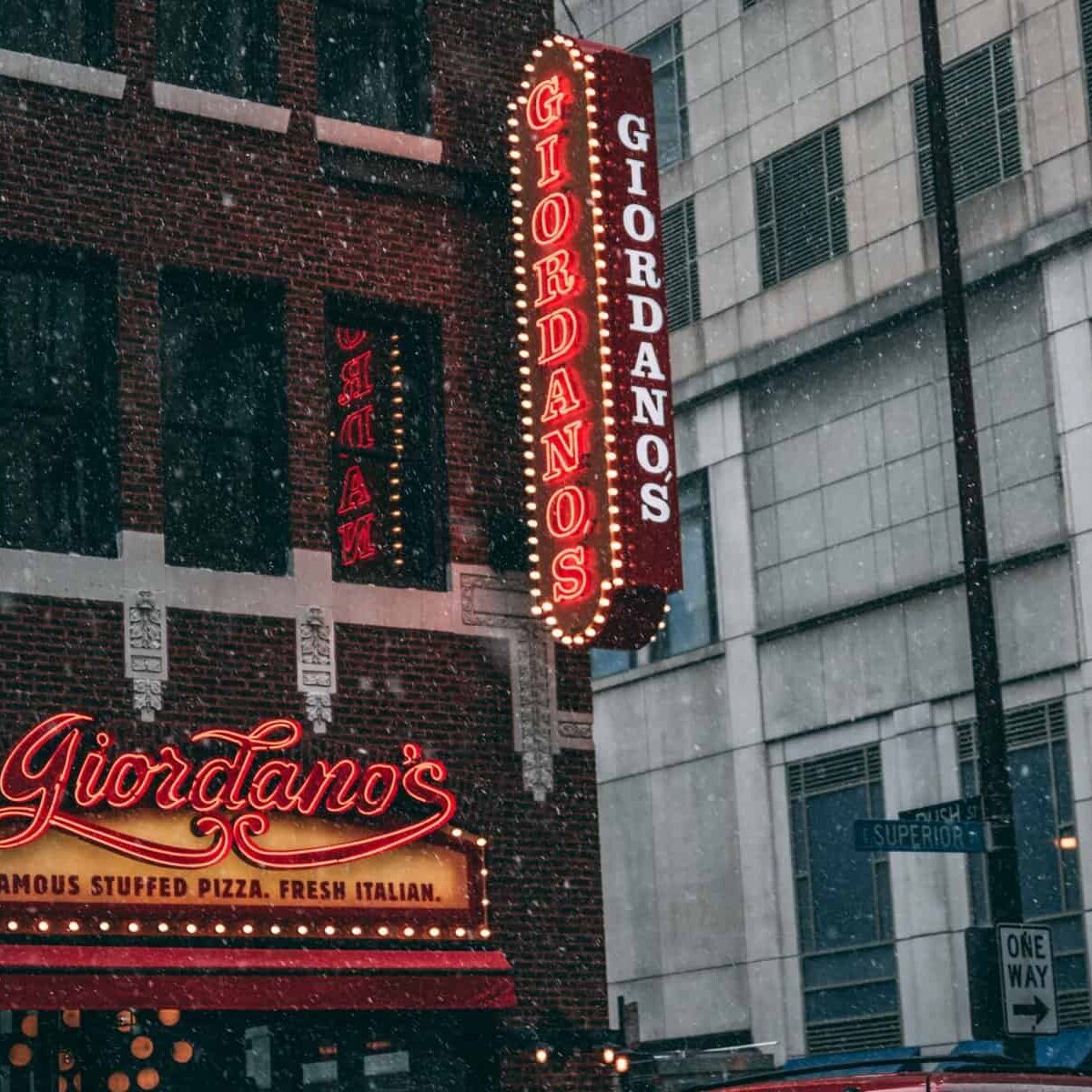 The exterior sign for Giordano's Pizza Place.