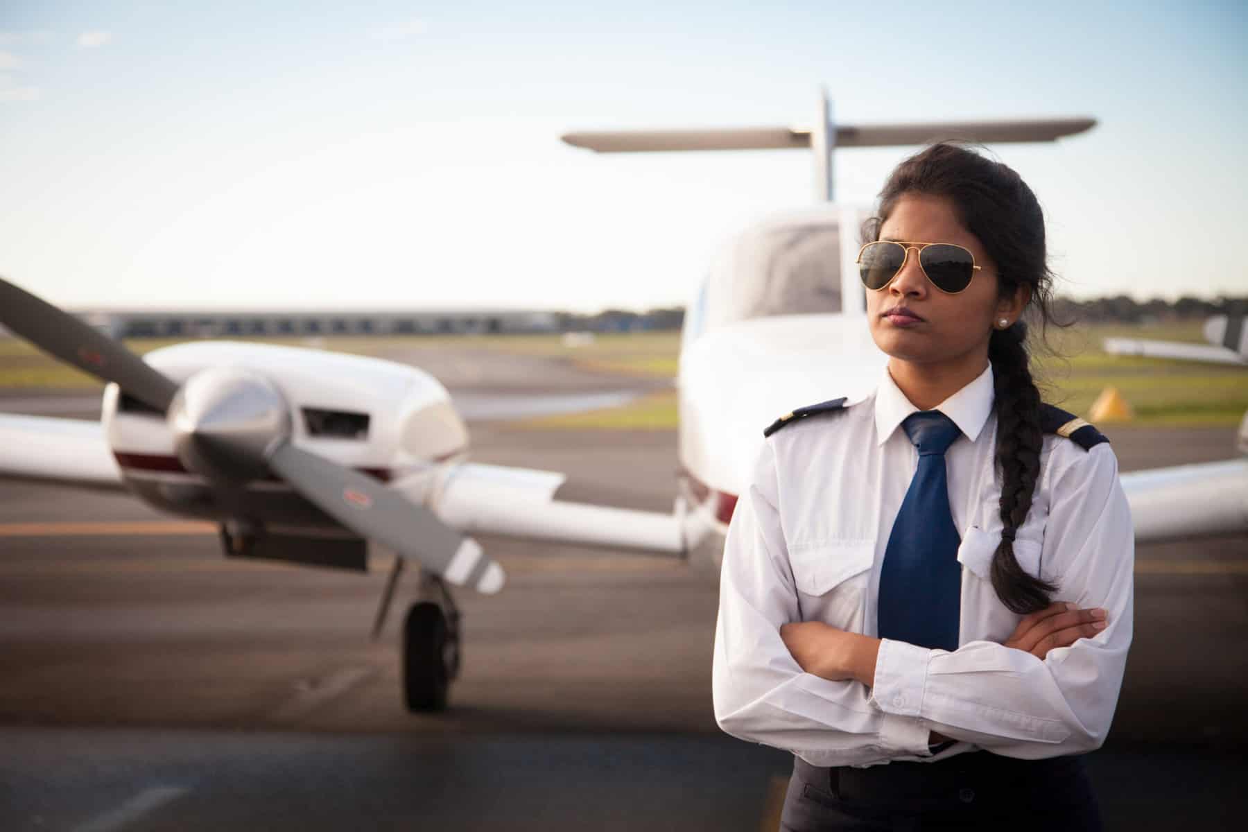 Instagram Female Pilot Standing in Front of Her Plane